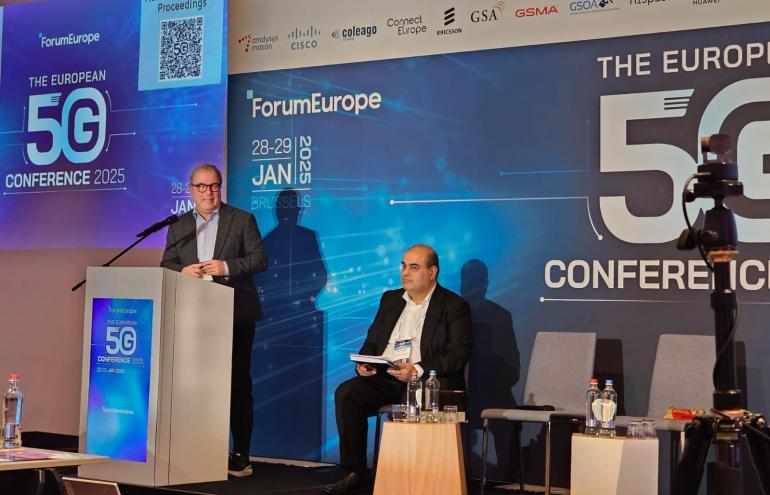 The image shows the BEREC Chair 2025 Robert Mourik (ComReg, Ireland) during his keynote speech at the Forum Europe - European 5G Conference.