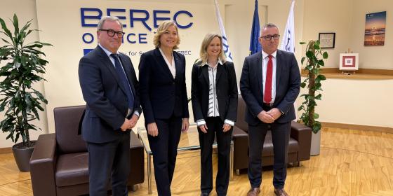 The image shows Henna Virkkunen (Executive Vice-President of the European Commission), BEREC Chair Robert Mourik (ComReg, Ireland), incoming BEREC Chair 2026 Marko Mismas (AKOS, Slovenia), and BEREC Office Director Verena Weber.