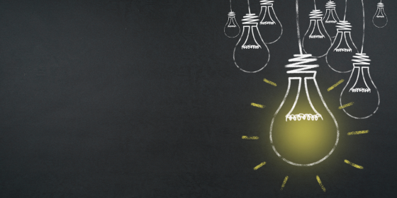 The image shows multiple light bulbs on a dark grey background.