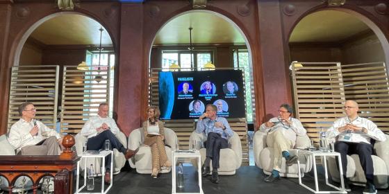 The image shows incoming BEREC Chair 2027 Alejandra de Iturriaga Gandini (CNMC, Spain) during the panel at Cullen's 40th anniversary conference.