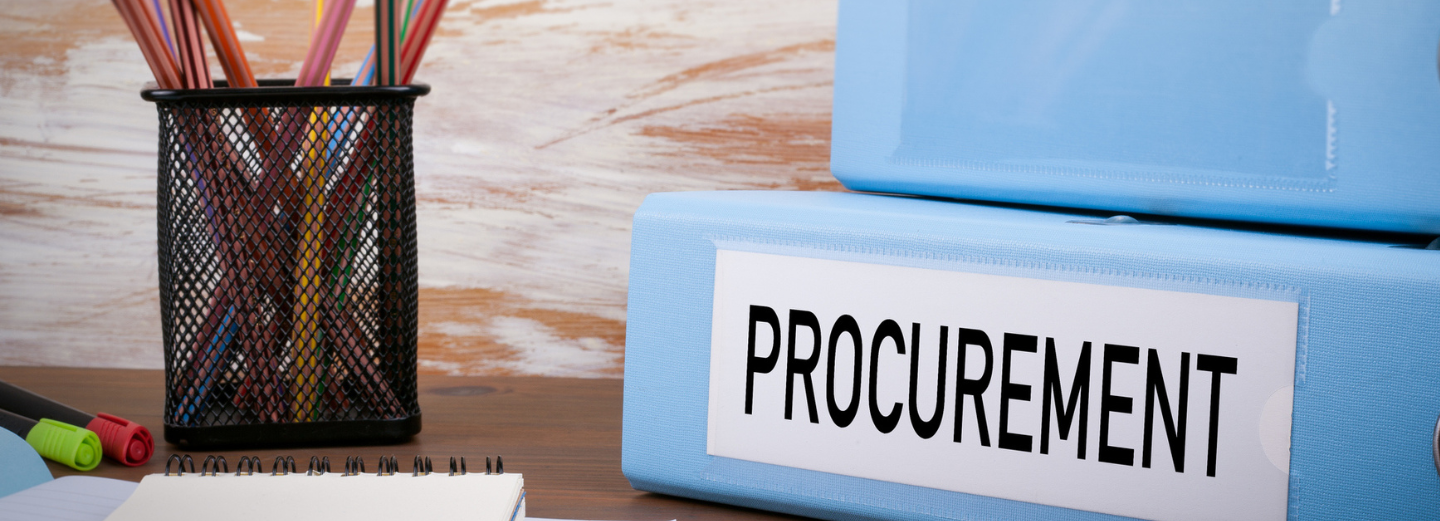 The image shows two folders with the words Procurement on them as well as multiple pencils in a pencil holder