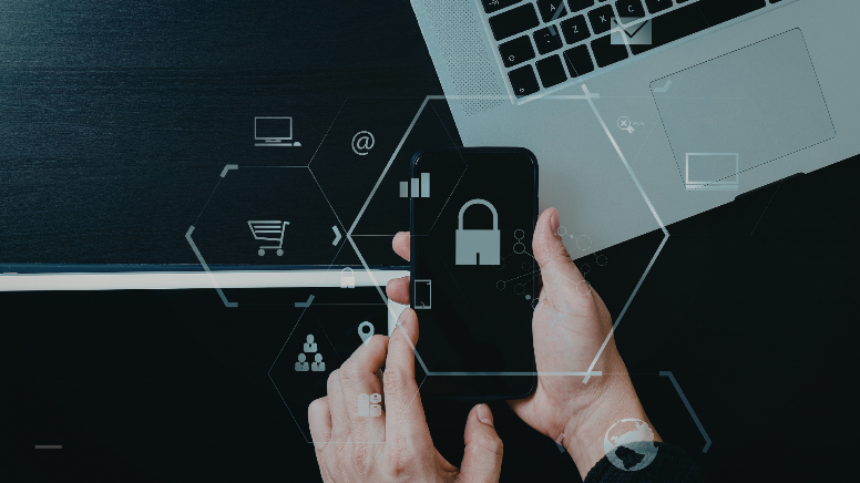 The image shows a person holding a mobile phone in both hands. Icons, such as a lock, are displayed across the image.