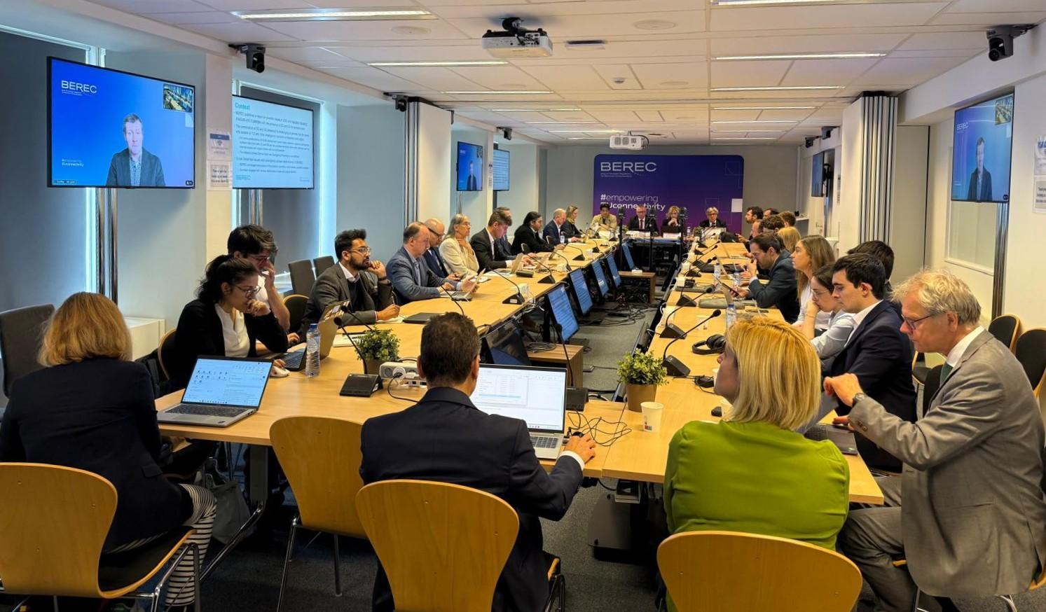 The image shows the BEREC pubic debriefing event, taking place on 10 June 2026 at the IRG Secretariat in Brussels, Belgium.