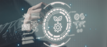 The image shows a person standing in front of a digital virtual screen displaying digital icons.