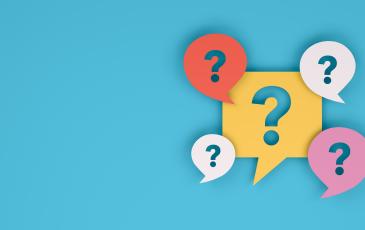 The image shows question marks on a colored background.