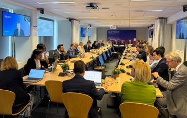 The image shows the BEREC pubic debriefing event, taking place on 10 June 2026 at the IRG Secretariat in Brussels, Belgium.
