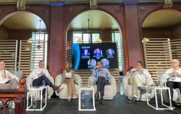The image shows incoming BEREC Chair 2027 Alejandra de Iturriaga Gandini (CNMC, Spain) during the panel at Cullen's 40th anniversary conference.