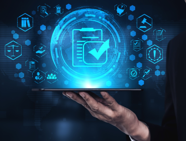 The image shows a person holding a tablet on the hand and above, different icons representing the telecommunications policy and regulation landscape