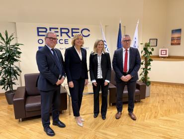 The image shows Henna Virkkunen (Executive Vice-President of the European Commission), BEREC Chair Robert Mourik (ComReg, Ireland), incoming BEREC Chair 2026 Marko Mismas (AKOS, Slovenia), and BEREC Office Director Verena Weber.