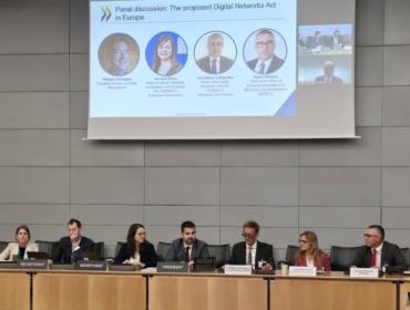 The image shows BEREC Chair Marko Mismas, alongside other panelists, at the OECD event on 6 May 2026.