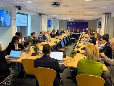 The image shows the BEREC pubic debriefing event, taking place on 10 June 2026 at the IRG Secretariat in Brussels, Belgium.