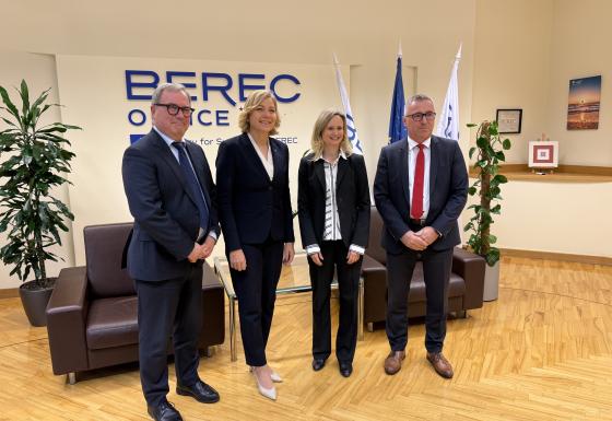 The image shows Henna Virkkunen (Executive Vice-President of the European Commission), BEREC Chair Robert Mourik (ComReg, Ireland), incoming BEREC Chair 2026 Marko Mismas (AKOS, Slovenia), and BEREC Office Director Verena Weber.